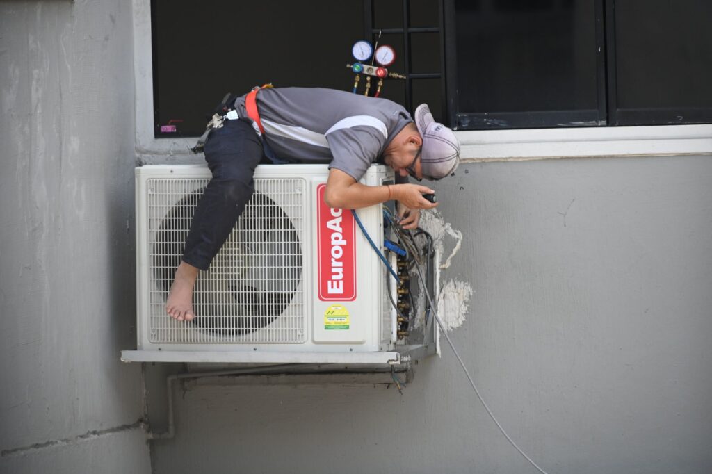 An HVAC technician on a service call