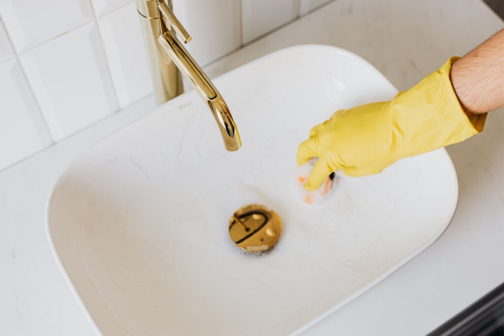 A plumber on a repair job